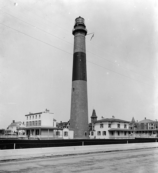 Absecon daymark was originally plain brick. At some point the black stripe was added. Photo courtesy Library of Congress
